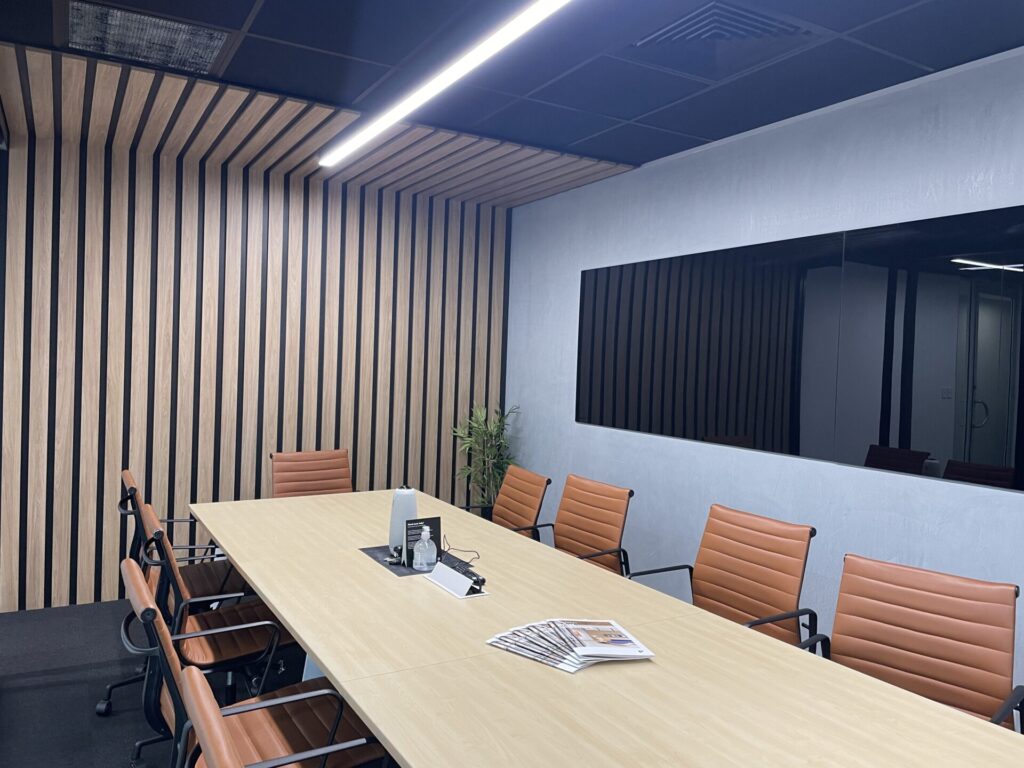 Meeting rooms, bespoke timber panelling and welcoming reception area for this office fit out for Parramatta Design Studio