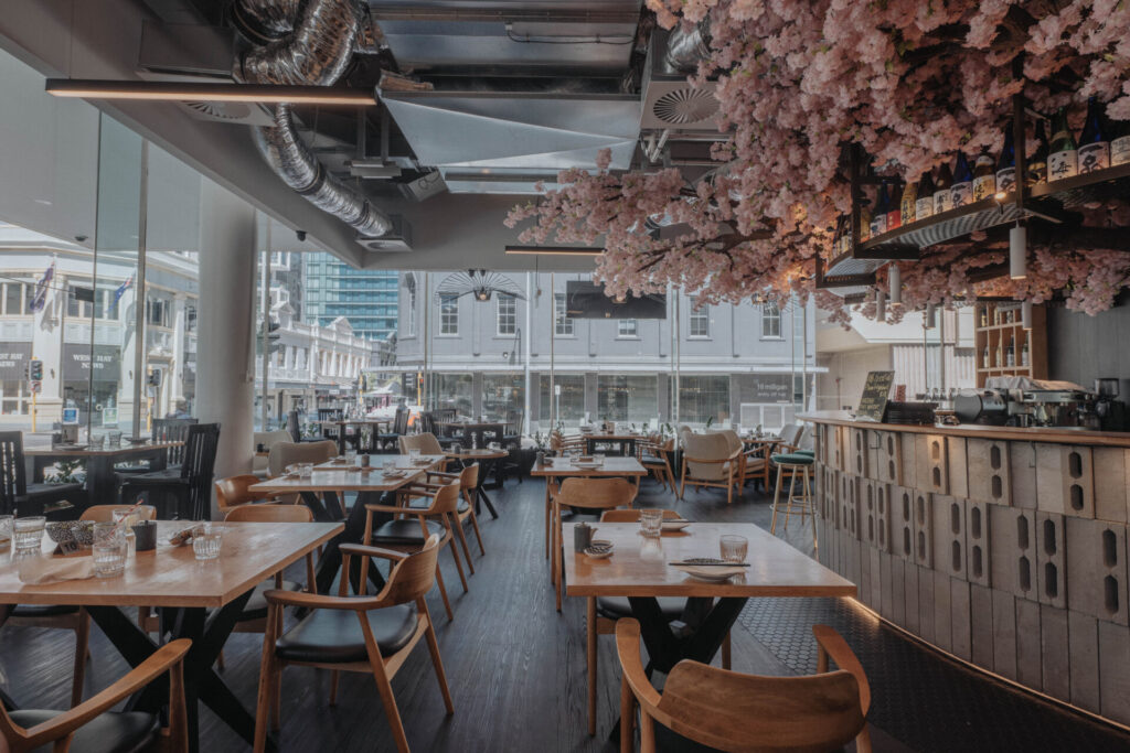 Custom cherry blossom tree feature, bespoke timber flooring and welcoming dining area for this hospitality fit out for Nippon