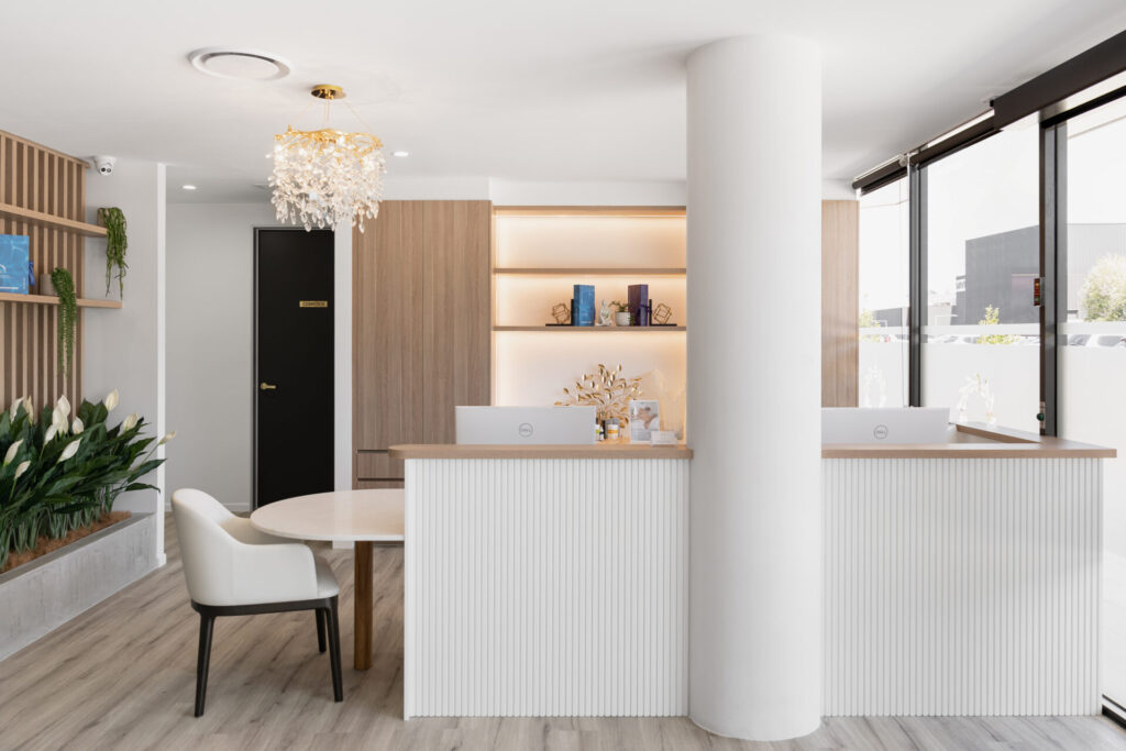 Neutral warm colour palette, bespoke timber panelling and welcoming reception area for this medical fit out for Plaza Central