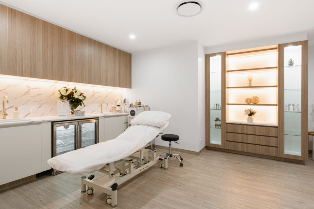 Neutral warm colour palette, bespoke timber panelling and welcoming reception area for this medical fit out for Plaza Central