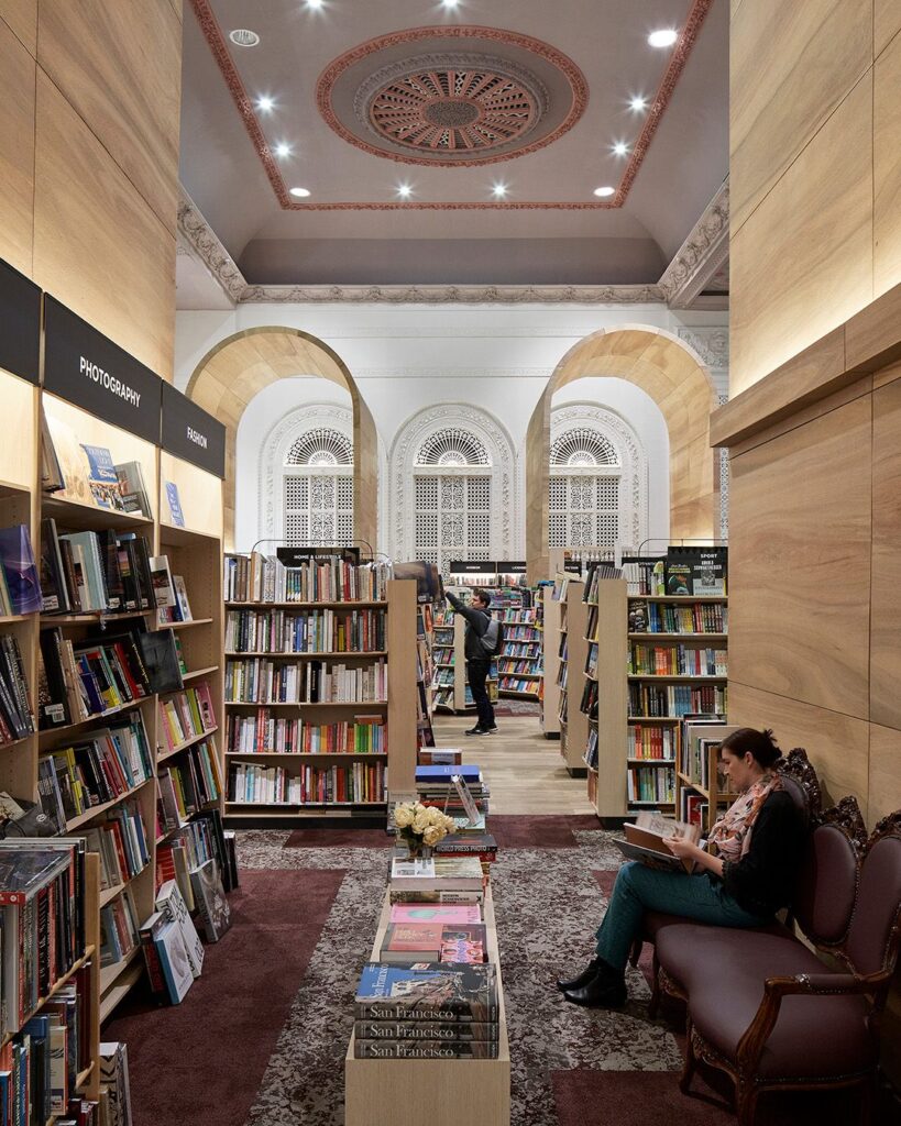 Heritage features, hardwood floors and large wooden arched displays for this retail fit out for Dymocks