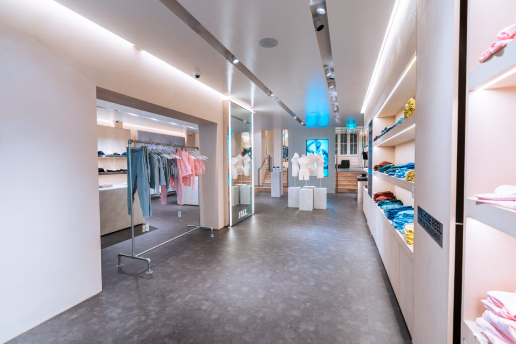 Durable concrete flooring, on-brand signage and bespoke merchandise displays for this retail fit out for Stax