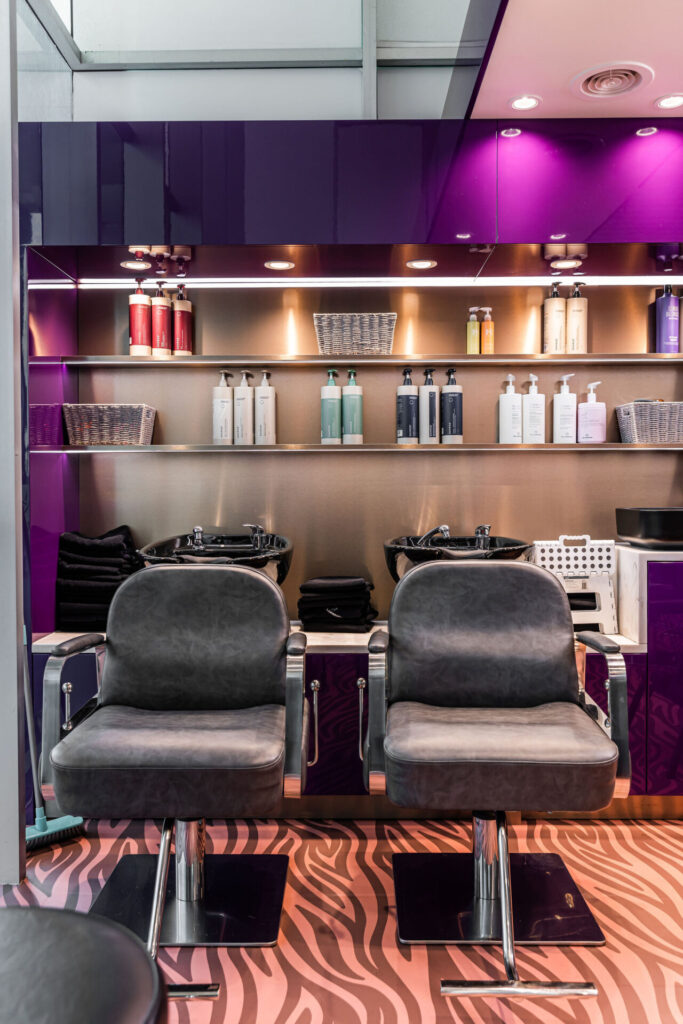 Purple and gold colour palette, custom LED signage and marble benchtops for this wellness & beauty fit out for Ayre Hair