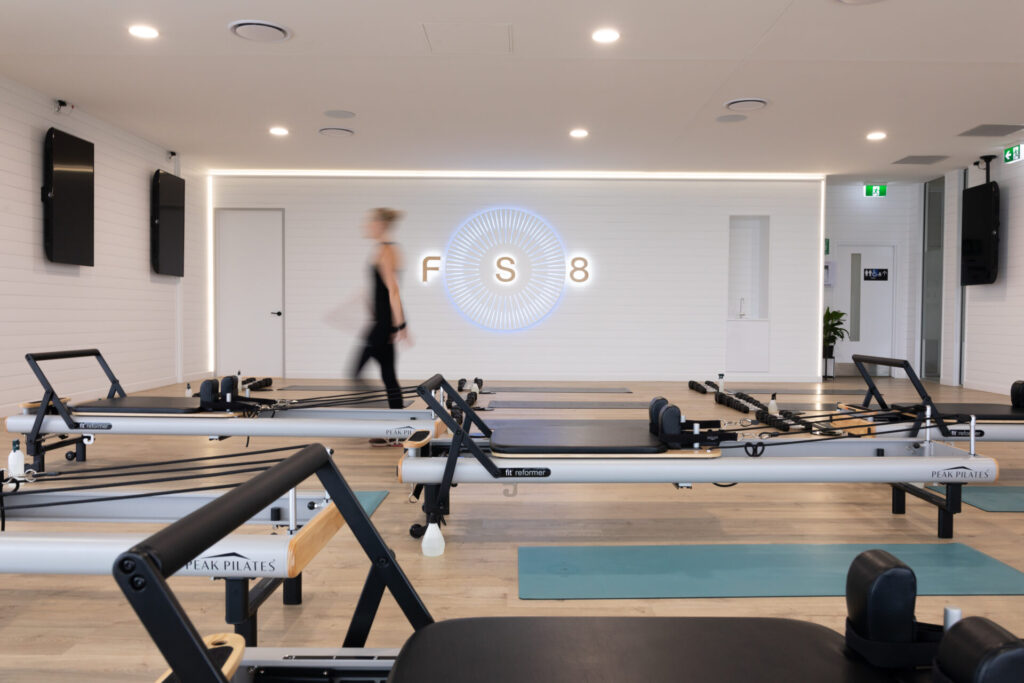 Pilates reformers, hardwood floors and welcoming reception area for this fitness fit out for FS8