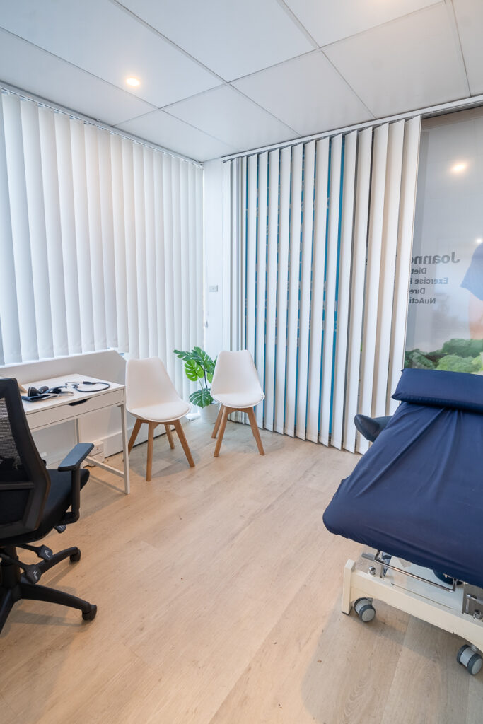 Neutral colour palette, blue and green pops of colour and welcoming reception area for this medical fit out for Nuactive Health