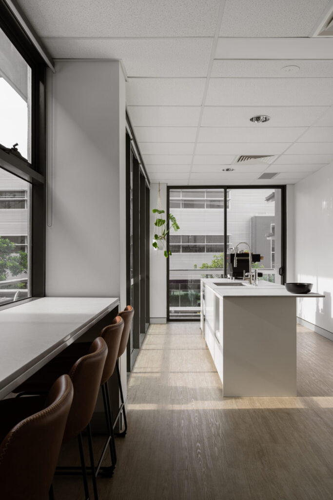 Floor to ceiling windows, hardwood floors and welcoming reception area for this office fit out for Smith and Sons