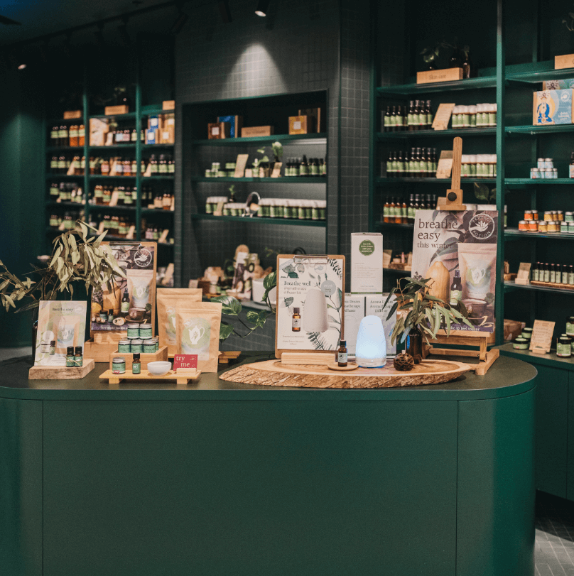 Dark green colour palette, bespoke cabinetry and green feature tiling for this retail fit out for Perfect Potion