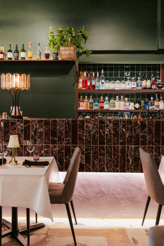 Burgundy counter tiling, counter LED strip lighting and green & burgundy old time colour palette for this hospitality fit out for Thai Room, Total Fitouts Adelaide Central