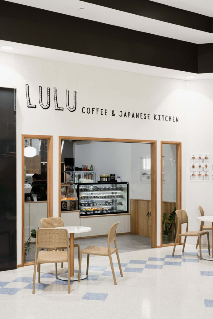 Neutral colour palette, custom LED signange and itimber door framing for this hospitality fit out for Lulus Japanese Cafe, Total Fitouts Wide Bay