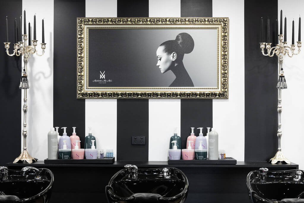 Black and white colour palette, eccentric styling and high end hair salon equiptment for this wellness and beauty fit out for Madame Me Mes, Total Fitouts Wide Bay