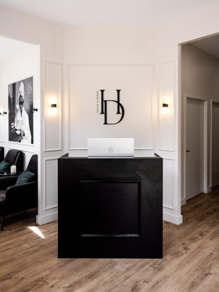 Wainscoting kept for heritage local feel, wall pendant lighting and black and white neutral colour palette for this wellness and beauty fit out for House of Derma, Total Fitouts Perth South