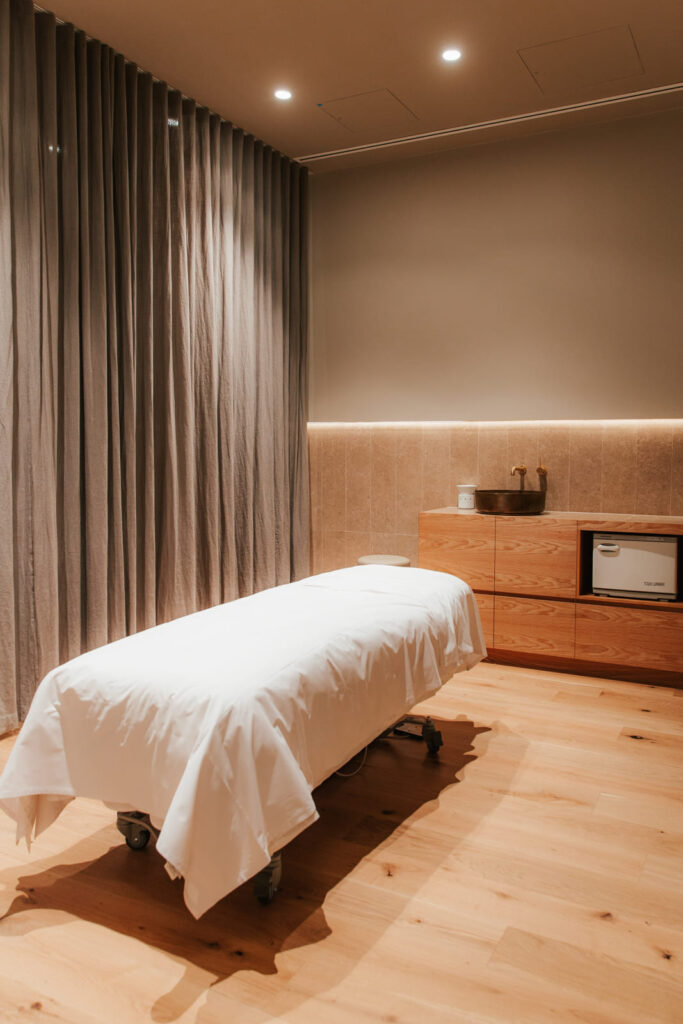 Earthy neutral colour palette, hardwood floors and welcoming reception area for this wellness and beauty fit out for A Touch of Beauty